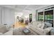 Inviting living room flowing into the kitchen, featuring large windows at 4971 Fairhaven Ne Way, Roswell, GA 30075
