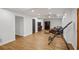 Open living area features wood floors, recessed lighting, and an attached bar and sitting area at 4971 Fairhaven Ne Way, Roswell, GA 30075