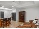 Cozy living room features wood floors, recessed lighting, and a convenient wet bar with stylish seating at 4971 Fairhaven Ne Way, Roswell, GA 30075