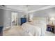 Bedroom with tray ceiling, neutral walls and carpet, plus en-suite bathroom access at 4971 Fairhaven Ne Way, Roswell, GA 30075