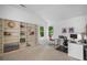 Bright office space features large built-in shelving and two workstations with natural light at 4971 Fairhaven Ne Way, Roswell, GA 30075