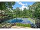 This property features two tennis courts perfect for recreation and fitness in a lush, private setting at 4971 Fairhaven Ne Way, Roswell, GA 30075