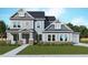 Charming two-story home featuring a covered porch, well-manicured lawn, and traditional architectural details at 507 Barnfield Way, Dallas, GA 30157