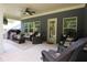 Spacious covered patio with outdoor seating, perfect for entertaining and enjoying the serene backyard at 5714 Pickens Garden Ln, Powder Springs, GA 30127