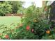 Lush backyard with vibrant flower garden, offering a tranquil and private outdoor space at 5714 Pickens Garden Ln, Powder Springs, GA 30127