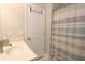 Clean bathroom featuring a sink, marble floors, and a shower with a striped curtain at 5714 Pickens Garden Ln, Powder Springs, GA 30127