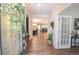 Bright foyer showcasing hardwood floors, natural light, and open floor plan with view to dining and living areas at 5714 Pickens Garden Ln, Powder Springs, GA 30127