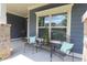 Inviting front porch area featuring comfortable seating and charming decor, perfect for enjoying the outdoors at 5714 Pickens Garden Ln, Powder Springs, GA 30127
