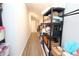 Hallway featuring organized storage shelves, offering ample space for belongings, and maximizing functionality at 5714 Pickens Garden Ln, Powder Springs, GA 30127
