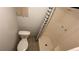 Bathroom featuring a toilet and shower/tub combo with curtain at 8436 Magnolia Dr, Jonesboro, GA 30238