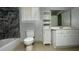 Bathroom featuring tub, toilet, sink, vanity, and cabinet at 8436 Magnolia Dr, Jonesboro, GA 30238