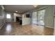 Open dining area and kitchen featuring tile flooring and access to an outdoor deck at 8436 Magnolia Dr, Jonesboro, GA 30238