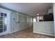 Dining room with French doors and wainscotting detail at 8436 Magnolia Dr, Jonesboro, GA 30238