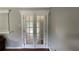 Close-up of decorative French doors with textured glass and ornate trim at 8436 Magnolia Dr, Jonesboro, GA 30238