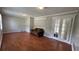 Cozy living room featuring laminate floors and decorative French doors at 8436 Magnolia Dr, Jonesboro, GA 30238