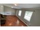 Bright living room with wood flooring, neutral walls, and plenty of natural light at 8436 Magnolia Dr, Jonesboro, GA 30238