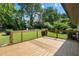 Large wooden deck overlooking a lush green backyard, ideal for relaxing and enjoying nature at 1409 Georgia Ave, East Point, GA 30344