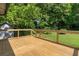 Inviting wooden deck providing a serene outdoor space to enjoy the lovely backyard and shade at 1409 Georgia Ave, East Point, GA 30344