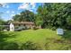 Expansive backyard featuring a well-maintained lawn and a charming deck, perfect for outdoor activities at 1409 Georgia Ave, East Point, GA 30344