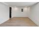 Spacious finished basement featuring sleek wood flooring and white walls at 1409 Georgia Ave, East Point, GA 30344