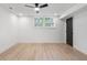 Finished basement with sleek fan and new windows offering ample natural light at 1409 Georgia Ave, East Point, GA 30344