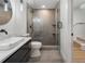Modern bathroom with sleek vanity, stylish fixtures, and a glass-enclosed shower at 1409 Georgia Ave, East Point, GA 30344