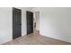 A bedroom with hardwood floors and doors at 1409 Georgia Ave, East Point, GA 30344