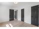Bedroom features hardwood floors, fresh white walls, and multiple sleek paneled interior doors at 1409 Georgia Ave, East Point, GA 30344
