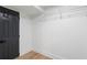 Closet with light wood flooring and a wire shelf for organized storage at 1409 Georgia Ave, East Point, GA 30344