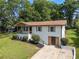 Stylish home featuring a whitewashed brick facade, a welcoming porch, and verdant landscaping at 1409 Georgia Ave, East Point, GA 30344