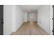 Bright hallway featuring recessed lighting and beautiful new hardwood floors at 1409 Georgia Ave, East Point, GA 30344