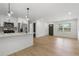 Well-lit kitchen featuring stainless steel appliances, white cabinetry, and a center island at 1409 Georgia Ave, East Point, GA 30344