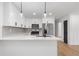 This kitchen features white cabinets, stainless steel appliances, and updated countertops at 1409 Georgia Ave, East Point, GA 30344