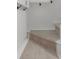 A well-lit staircase featuring neutral-toned carpet runner, and clean white walls at 1409 Georgia Ave, East Point, GA 30344