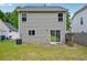 Back exterior view of the home with sliding door to yard and privacy fence at 231 Silver Fox Trl, Dallas, GA 30157