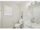 Small bathroom with toilet and pedestal sink at 231 Silver Fox Trl, Dallas, GA 30157