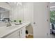 This bathroom features a white vanity and a door leading to another room at 231 Silver Fox Trl, Dallas, GA 30157