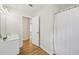 A bright bathroom featuring wood-look flooring, shower with curtain, and white vanity at 231 Silver Fox Trl, Dallas, GA 30157