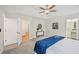 This spacious bedroom features neutral walls, soft carpet, and tray ceiling with ceiling fan at 231 Silver Fox Trl, Dallas, GA 30157