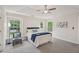 This bedroom has windows providing lots of light and tray ceiling with fan at 231 Silver Fox Trl, Dallas, GA 30157
