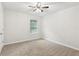 Neutral bedroom with carpet, ceiling fan, and window at 231 Silver Fox Trl, Dallas, GA 30157
