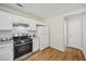 Kitchen featuring stainless steel oven and white refrigerator at 231 Silver Fox Trl, Dallas, GA 30157