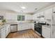 Well-lit kitchen featuring granite countertops and stainless steel appliances at 231 Silver Fox Trl, Dallas, GA 30157
