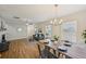 Open-concept living space with modern furniture and a dining table set for dinner at 231 Silver Fox Trl, Dallas, GA 30157