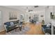 Spacious living area featuring hardwood floors, modern furniture, and natural light at 231 Silver Fox Trl, Dallas, GA 30157