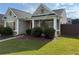 Well-manicured lawn and established landscaping enhance the curb appeal of this charming home at 2979 Dungeness Dr, Douglasville, GA 30135
