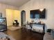 Inviting living room with hardwood floors, large TV, and neutral decor create a cozy atmosphere at 2979 Dungeness Dr, Douglasville, GA 30135