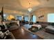 Comfortable living room with hardwood floors, designer lighting, and an open layout to the kitchen at 2979 Dungeness Dr, Douglasville, GA 30135