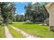 Large backyard with mature trees at 338 Patterson Rd, Lawrenceville, GA 30044