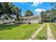Home exterior with spacious backyard and mature trees at 338 Patterson Rd, Lawrenceville, GA 30044